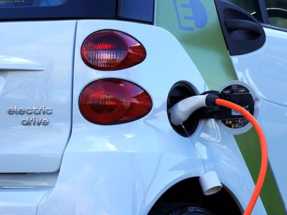 Electric car charging at charging station