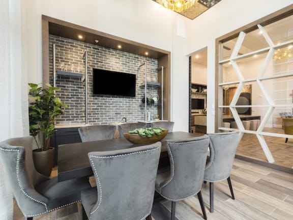 Wine Tasting Room with large table and chairs at Residences at the Green in Lakewood Ranch