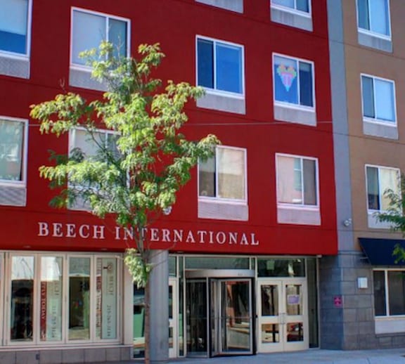 A red building with the words Beech International on it.