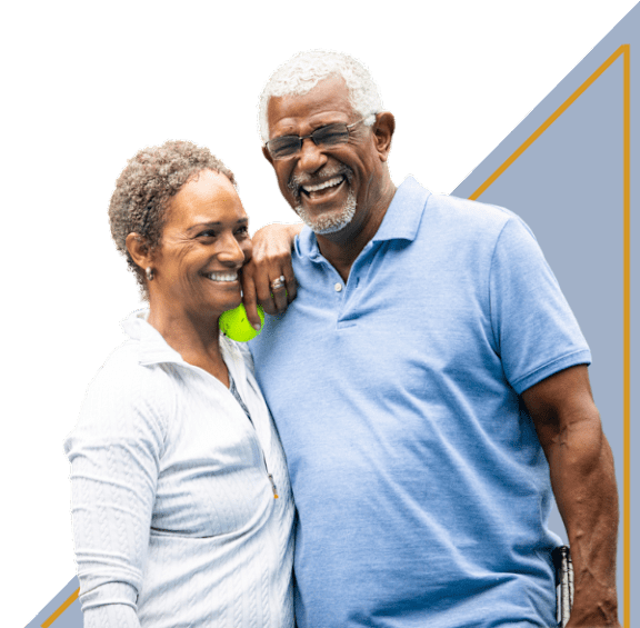 A man and a woman are standing close together, both smiling.