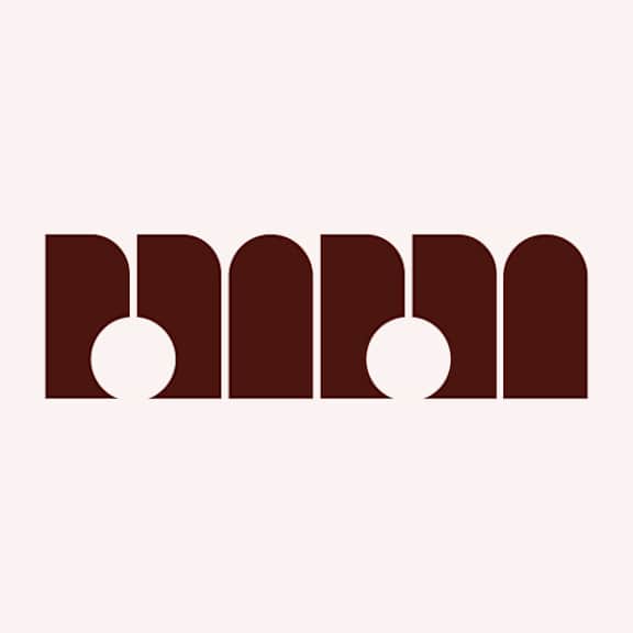 A graphic with three dark brown shapes and two white circles.