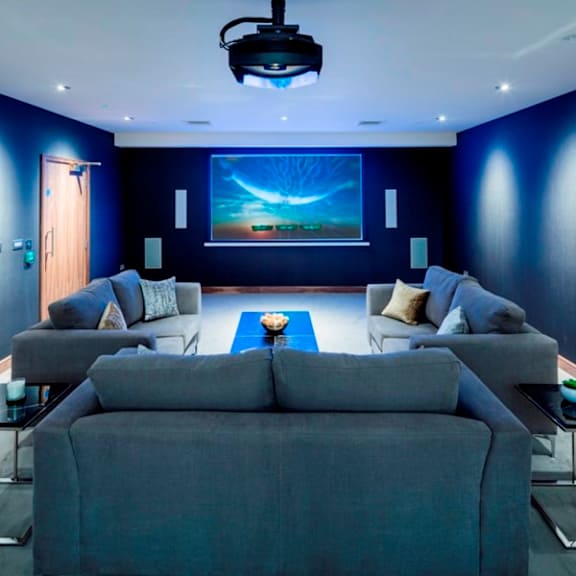 a blue living room with a blue wall and a blue couch