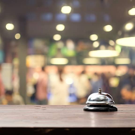 a bell sitting on top of a wooden table