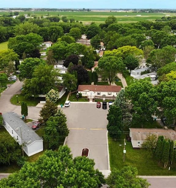 an aerial view of a neighborhood with houses and trees