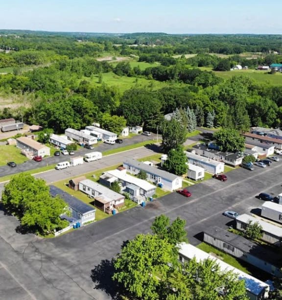 an aerial view of a building complex in a parking lot