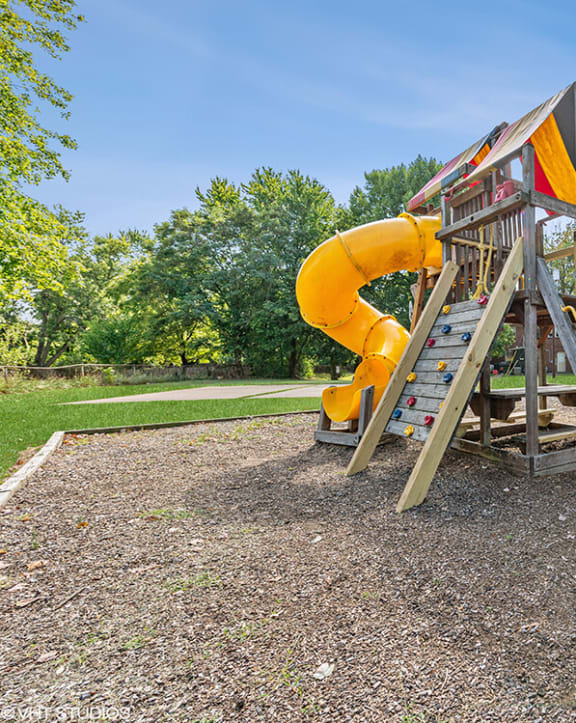 a slide on a playground in a park