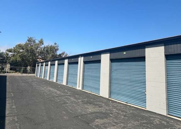 the side of a building with roll up garage doors