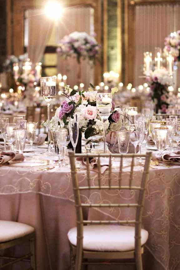 A table set for a formal dinner with candles and flowers. at The Pennsylvanian Apartments, Pittsburgh, Pennsylvania