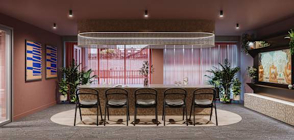 the lobby of a restaurant with a long table and chairs