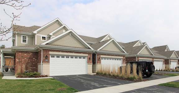 a house with a white garage door in front of it