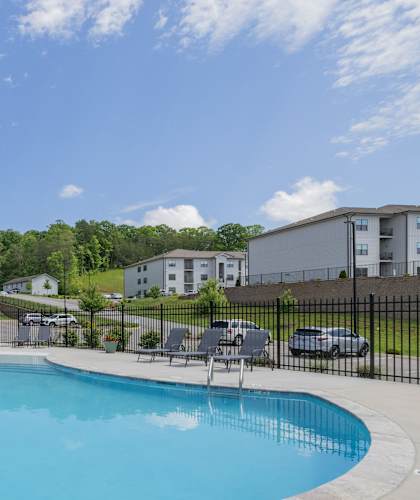 the preserve at ballantyne commons resort style swimming pool with chairs and apartment buildings