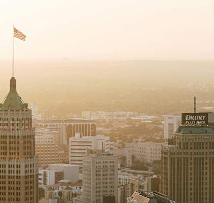 the skyline of the city at sunset