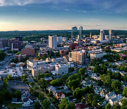 A cityscape with a mix of residential and commercial buildings.