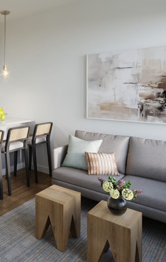a living room with a couch and a kitchen