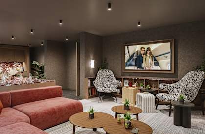 a living room with couches and tables and a painting on the wall