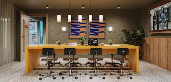 a conference room with a wooden desk and chairs