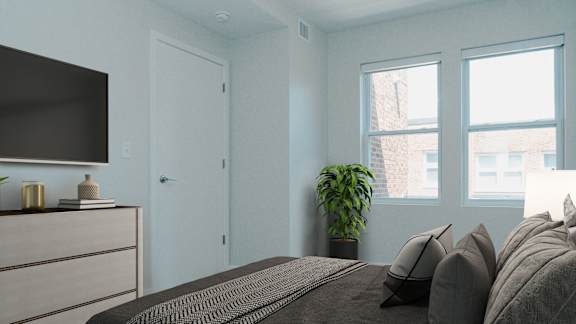 A bedroom with a bed, dresser, and window.