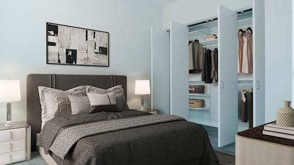 A bedroom with a large bed and a wardrobe.