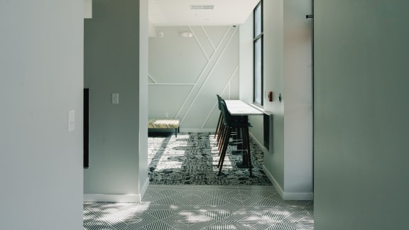 a hallway with a table and chairs in a house at Howard Manor, Washington, DC, 20001