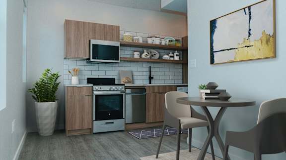 A modern kitchen with a dining table and chairs.