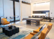 Thumbnail 7 of 23 - a large living room with a large table and chairs