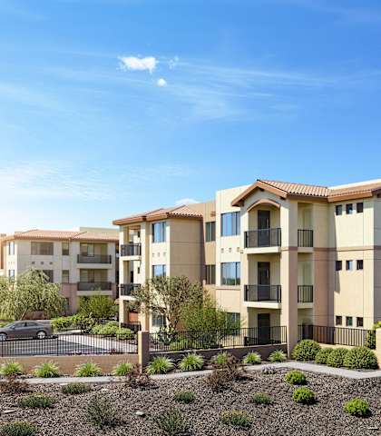 an image of a large apartment building in the desert at The Safford, Marana, AZ 85743