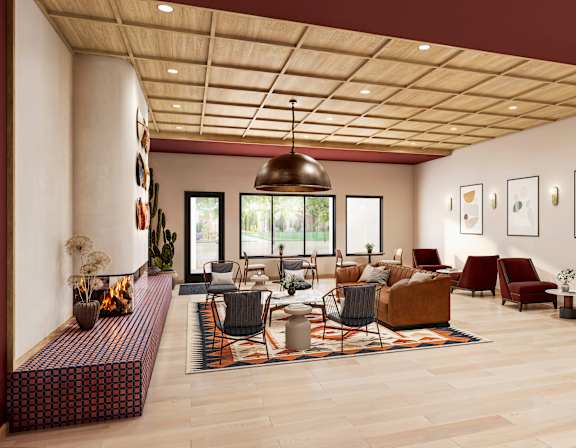Clubhouse lounge with fireplace and contemporary furnishings at Turquoise Trail Apartments, Santa Fe, NM 87508