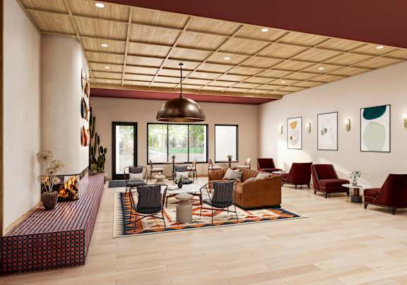 Clubhouse lounge with fireplace and contemporary furnishings at Turquoise Trail Apartments, Santa Fe, NM
