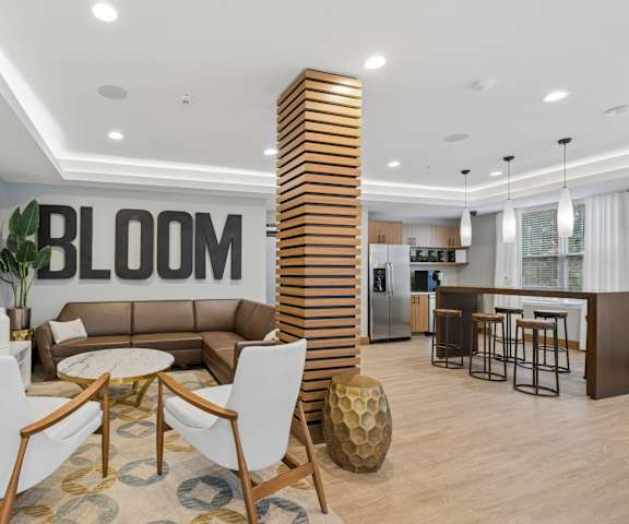 A modern living room with a large sofa, a coffee table, and a tall wooden column.