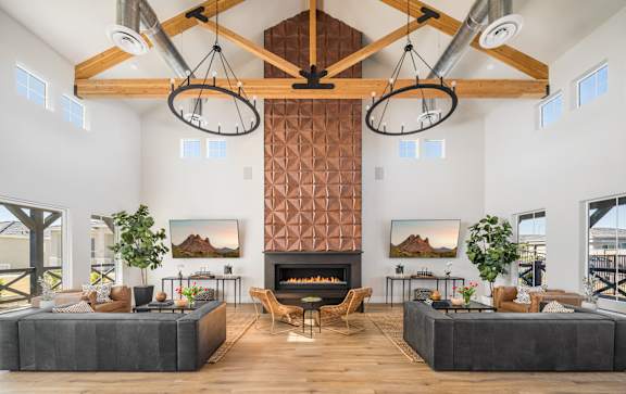 A modern living room with a fireplace and a large screen TV.