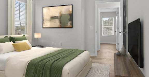 A bedroom with a large bed and a painting on the wall at Grand at Pearl Apartments, Mississippi