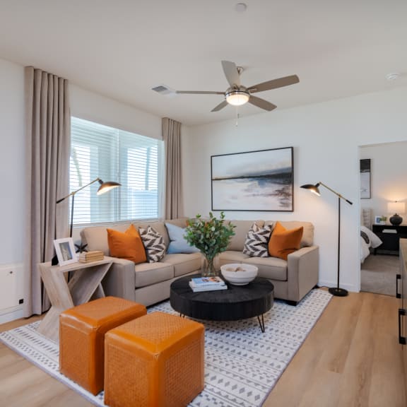 a living room with a couch and a wooden cabinet