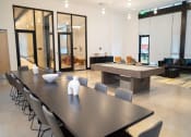 Thumbnail 5 of 23 - a conference room with a ping pong table and a billiards table