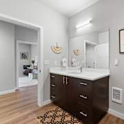 A top-down view of a well-organized apartment with a kitchen, living room, and bedroom.
