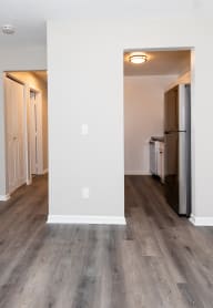 a kitchen with stainless steel appliances and white cabinets