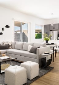 a rendering of a living room and kitchen in an open concept home