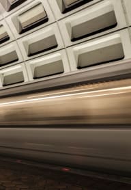 a subway train speeding through a subway station
