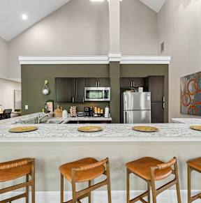 the preserve at ballantyne commons clubhouse with kitchen and living roomat River Oak Apartments, Louisville, KY, 40206