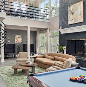 a tennis court with an apartment building in the backgroundat River Oak Apartments, Louisville, KY, 40206
