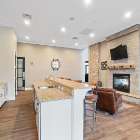 the preserve at ballantyne commons community kitchen and living room with fireplace