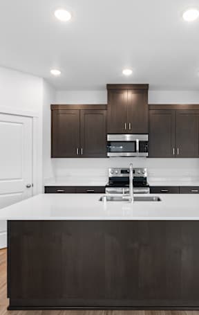 a kitchen with a large island in the middle of it