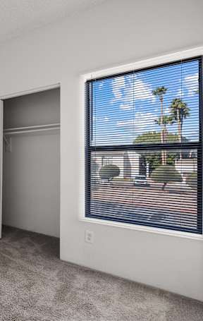 A white room with a door and a window.