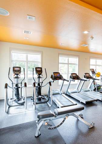 the gym at Midtown Sam Houston Apartments, Huntsville, TX, 77340