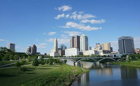 A city skyline with a river running through it.
