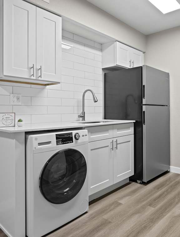a kitchen with stainless steel appliances and a sink