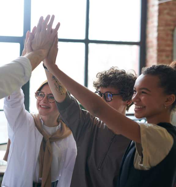 Group of People High-fiving at The Flats at Riverwoods, Provo, 84604