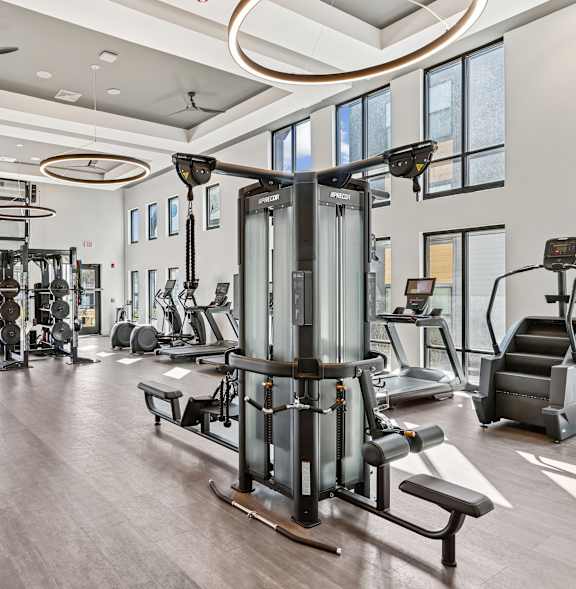 A room with wooden walls and a black mat on the floor.