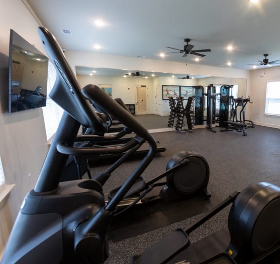 gym with exercise equipment at the district at highland village apartments