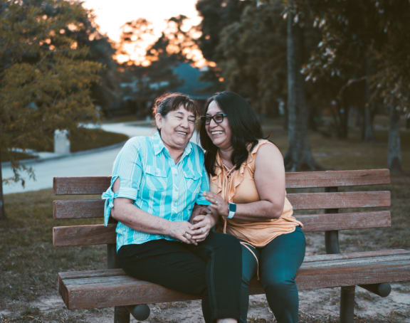 a couple sitting on a park bench