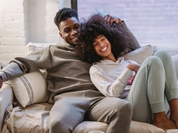 a couple sitting on a couch